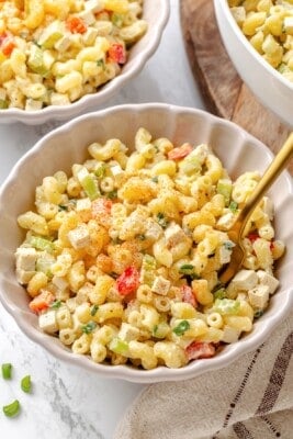 A bowl of vegan macaroni salad with a fork.