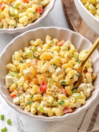A bowl of vegan macaroni salad with a fork.