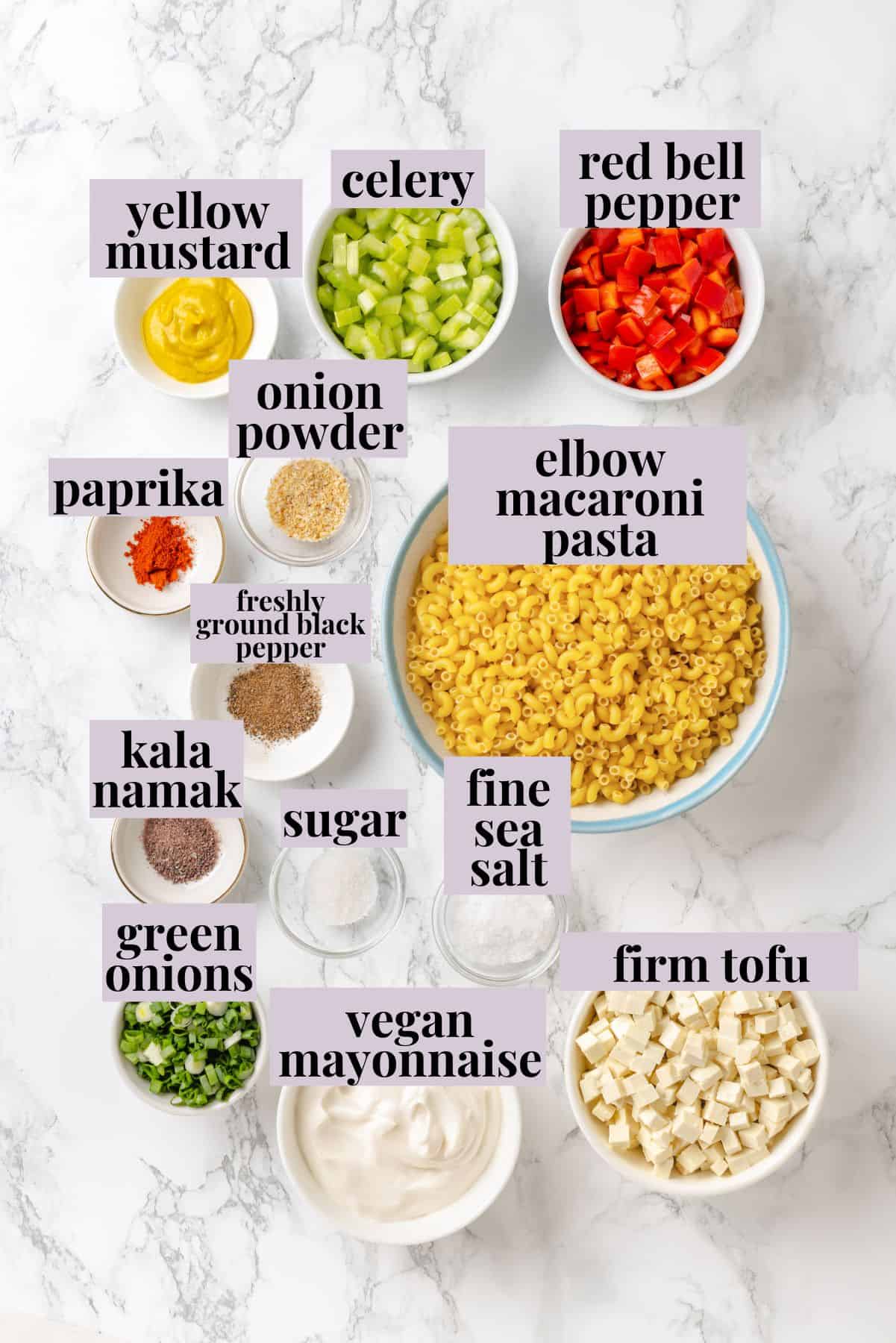 Creamy and crunchy, this macaroni salad recipe is made with crumbled tofu and a touch of kala namak for that old-school eggy flavor. Labeled ingredients for macaroni salad recipe.