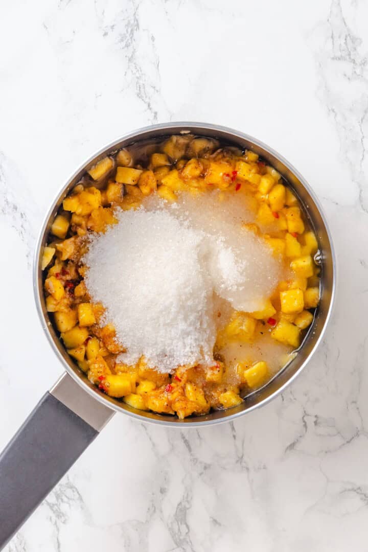 Sweet, savoury, and just a little spicy, this smooth, chunky mango chutney marries traditional Jamaican and Indian flavours beautifully. Adding sugar to mango chutney.