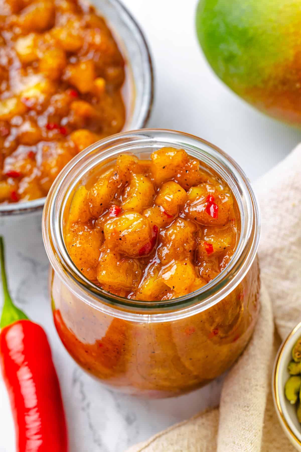 Sweet, savoury, and just a little spicy, this smooth, chunky mango chutney marries traditional Jamaican and Indian flavours beautifully. A jar of mango chutney.