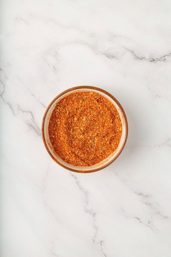 These vegan soy curl tacos pair perfectly crispy soy curl "chicken" with classic taco toppings and the BEST tangy, creamy lime sauce. Homemade taco seasoning in a bowl.