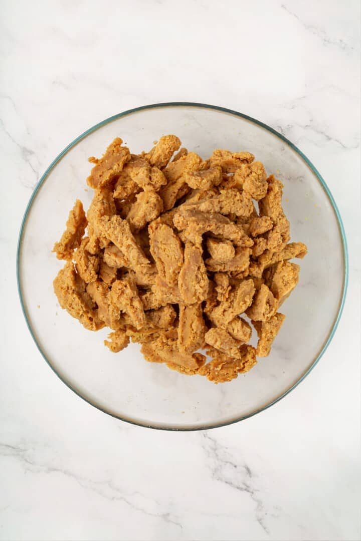 These vegan soy curl tacos pair perfectly crispy soy curl "chicken" with classic taco toppings and the BEST tangy, creamy lime sauce. Rehydrated, drained, and squeezed soy curls.