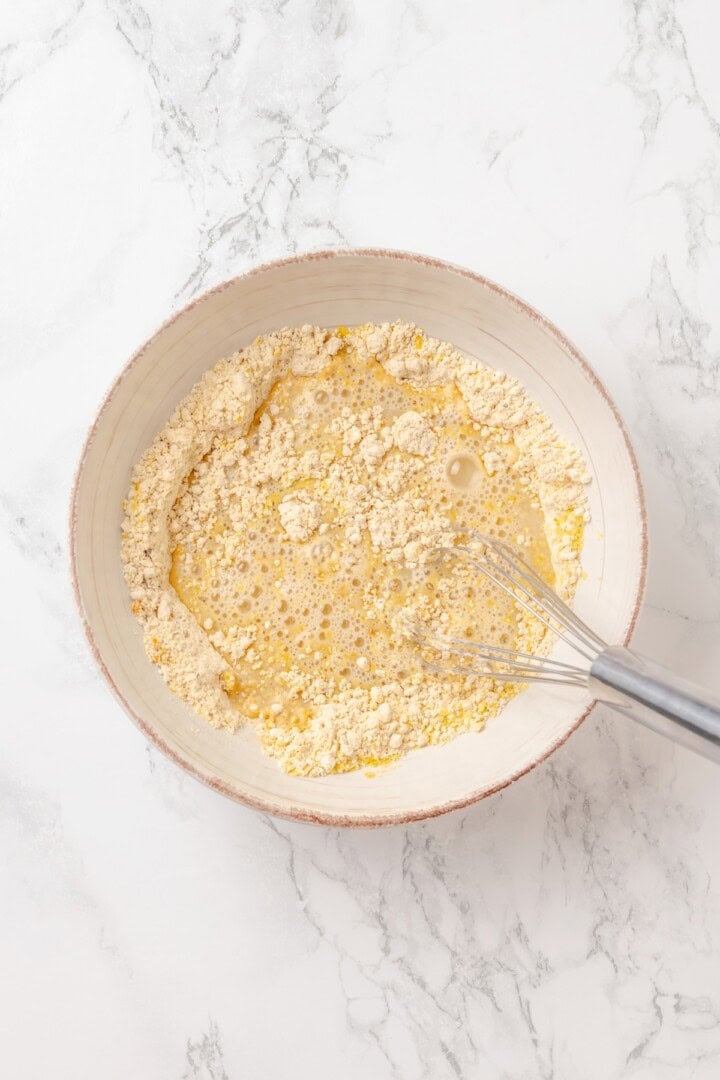 Start today right with this vegan omelette! Chickpea flour and water combine to make a tender omelette filled with veggies and vegan cheese. Whisking apple cider vinegar, water, and olive oil into a mixture of chickpea flour, nutritional yeast, and seasonings.