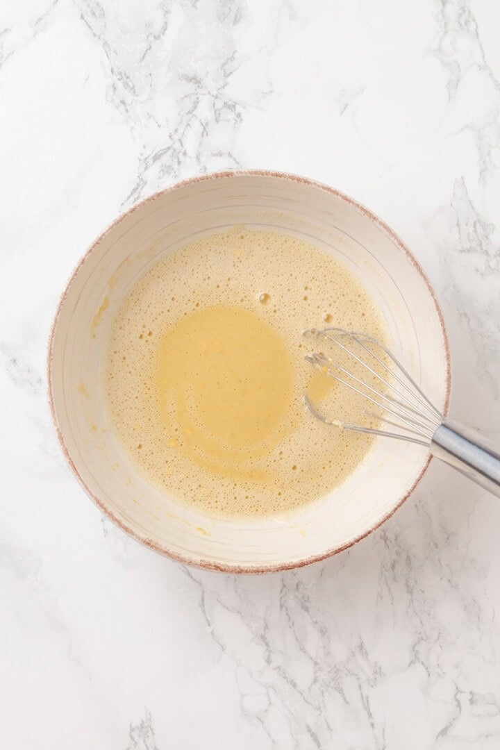 Start today right with this vegan omelette! Chickpea flour and water combine to make a tender omelette filled with veggies and vegan cheese. Chickpea flour omelette batter in a bowl.