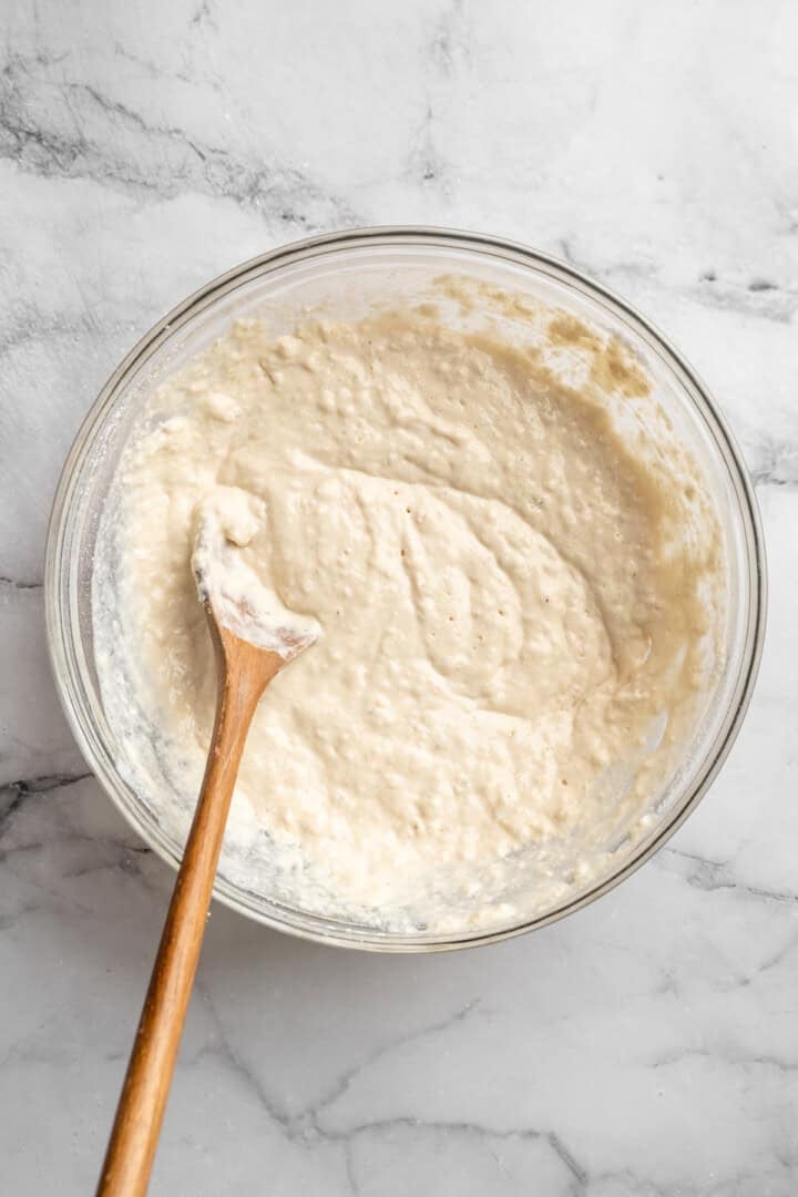Easy to make and SO light and fluffy, these vegan cottage cheese pancakes are about to become your go-to, protein-packed breakfast. Vegan cottage cheese pancake batter in a bowl.