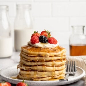 A stack of vegan cottage cheese pancakes on a plate.
