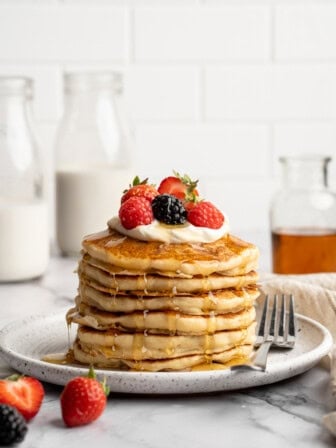 A stack of vegan cottage cheese pancakes on a plate.