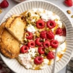Tofu cottage cheese in a bowl with berries and nuts.