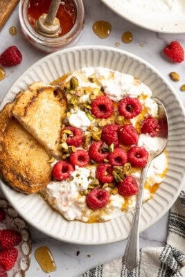 Tofu cottage cheese in a bowl with berries and nuts.