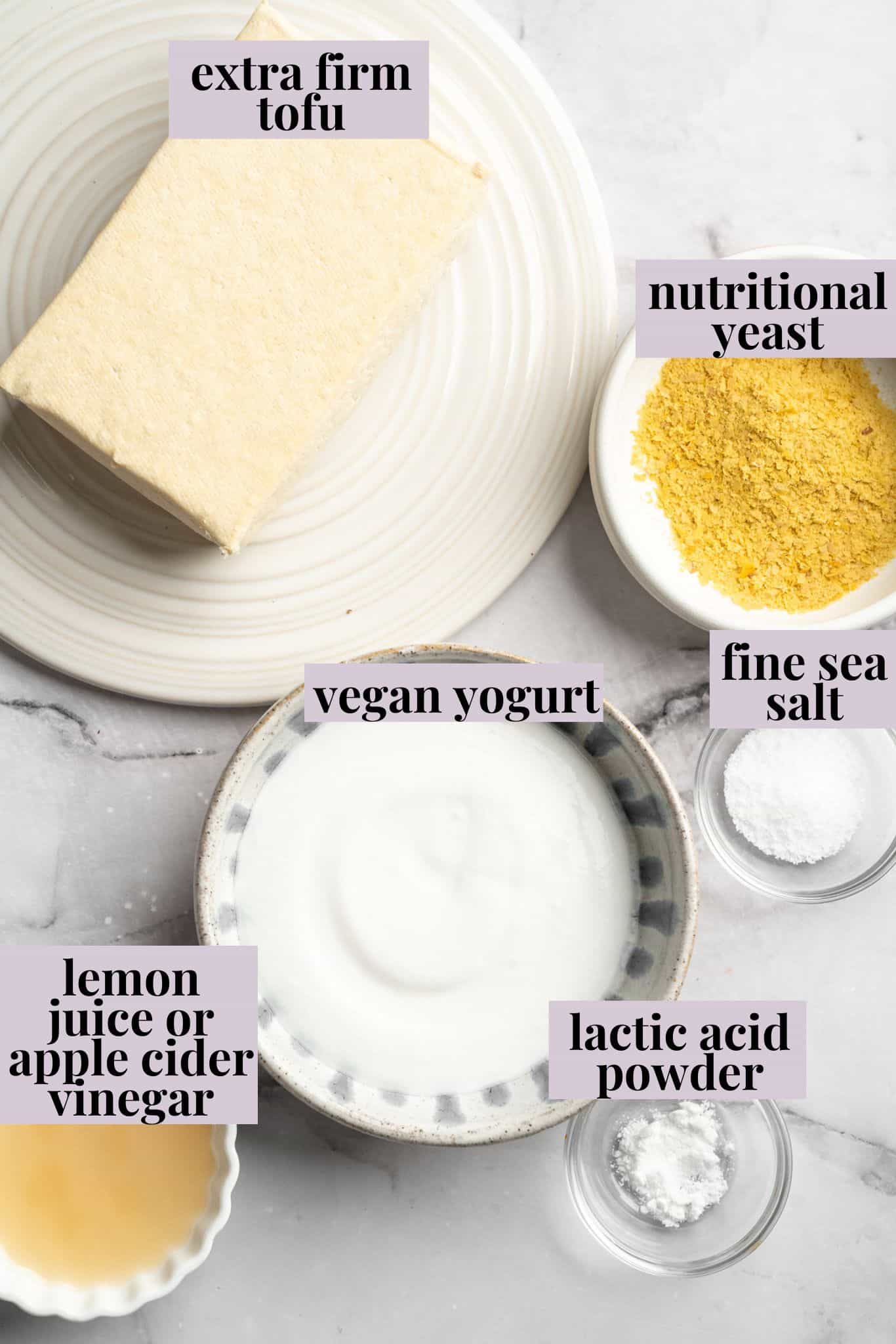 This vegan cottage cheese recipe marinates perfectly tender tofu "curds" in a savoury, tangy, salty sauce. It's a vegan staple you need! Labeled ingredients for vegan tofu cottage cheese.