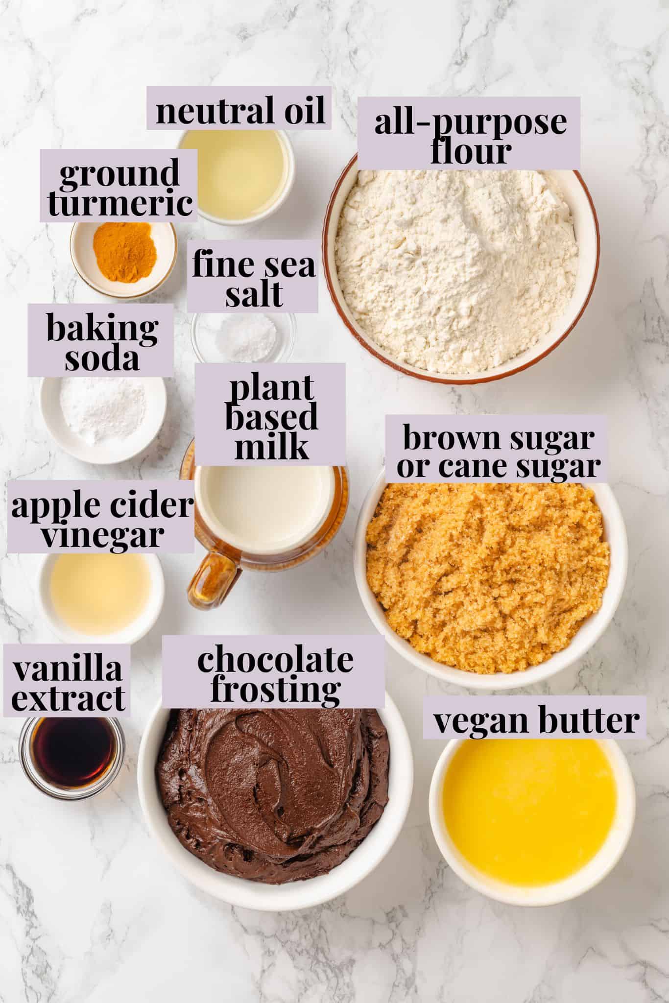 This vegan yellow cake is made of two layers of moist, tender, golden-yellow cake, filled and frosted with silky chocolate buttercream. Labeled ingredients for vegan yellow cake.