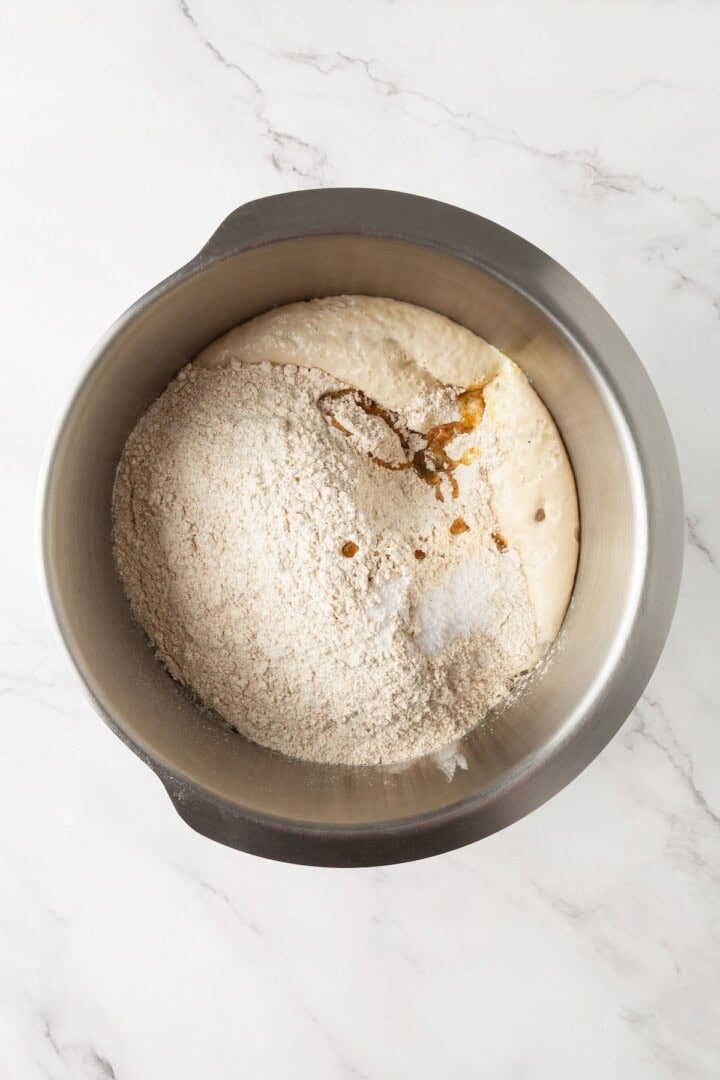 Looking for the perfect slice to build your PB&J or avocado toast on? This soft, tender whole grain sandwich bread is for you. Adding olive oil, salt, whole wheat flour, and sugar to activated yeast and water.