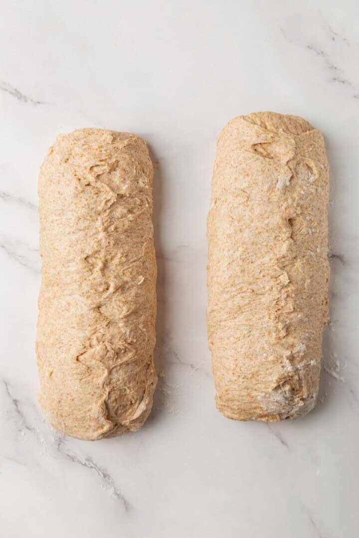 Looking for the perfect slice to build your PB&J or avocado toast on? This soft, tender whole grain sandwich bread is for you. Whole grain bread dough rolled tightly into 2 logs.