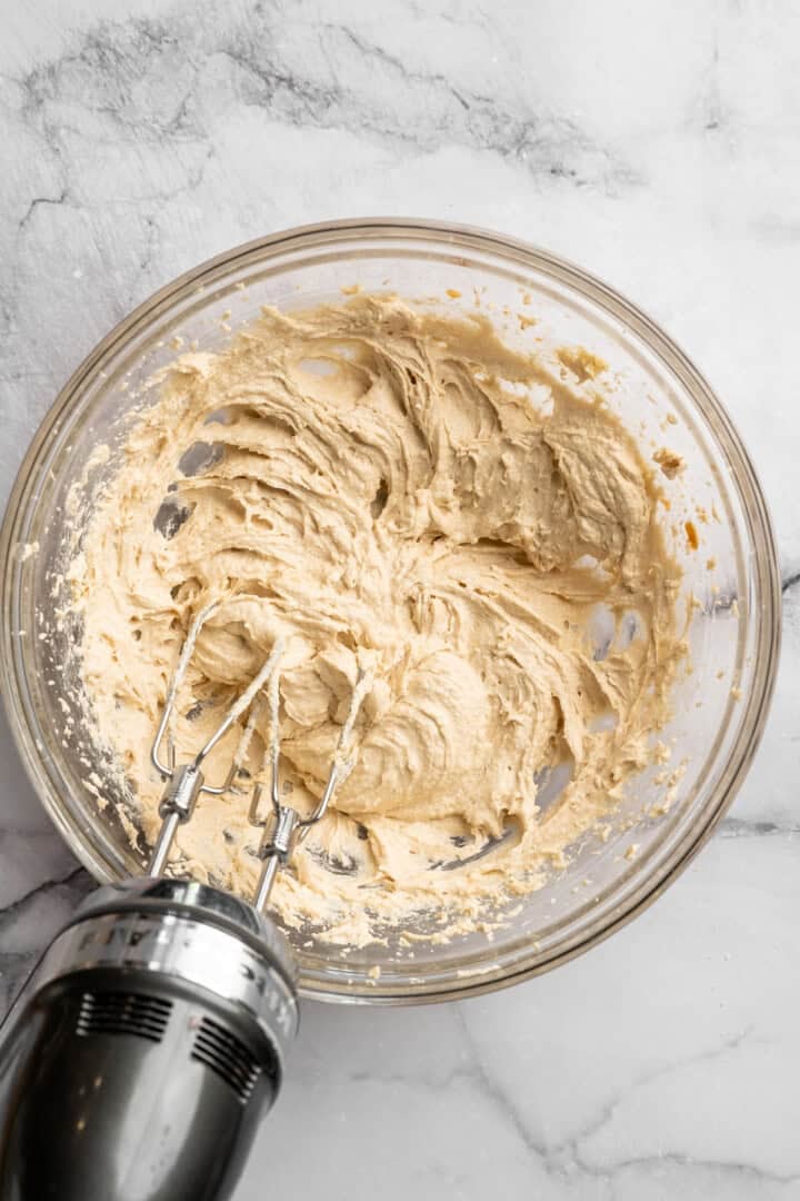 These vegan sourdough chocolate chip cookies are about to up your cookie standards. They're tender and chewy with a subtle sourdough tang. Whisking together the wet ingredients for sourdough cookie dough.