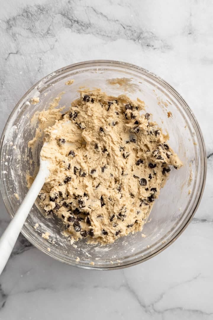These vegan sourdough chocolate chip cookies are about to up your cookie standards. They're tender and chewy with a subtle sourdough tang. Chocolate chips folded into sourdough cookie dough.
