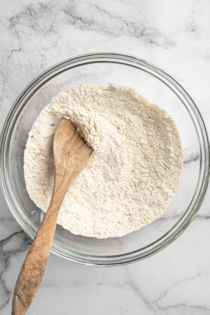 What to do with that sourdough discard? These easy sourdough discard crackers are crunchy, crispy, and flaky, with that best sourdough tang. Flour, nutritional yeast, seasonings, and lactic acid powder mixed together in a bowl.