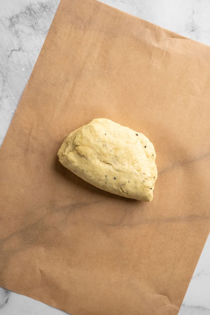 What to do with that sourdough discard? These easy sourdough discard crackers are crunchy, crispy, and flaky, with that best sourdough tang. Folding sourdough discard cracker dough over and onto itself.