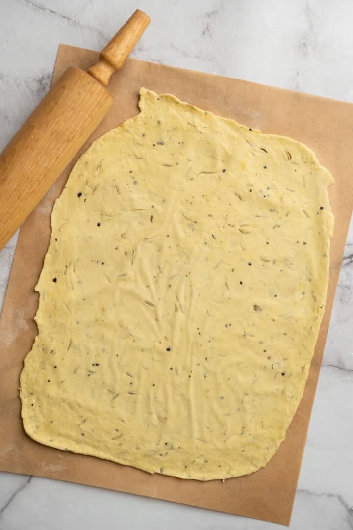 What to do with that sourdough discard? These easy sourdough discard crackers are crunchy, crispy, and flaky, with that best sourdough tang. Sourdough discard cracker dough rolled thin.