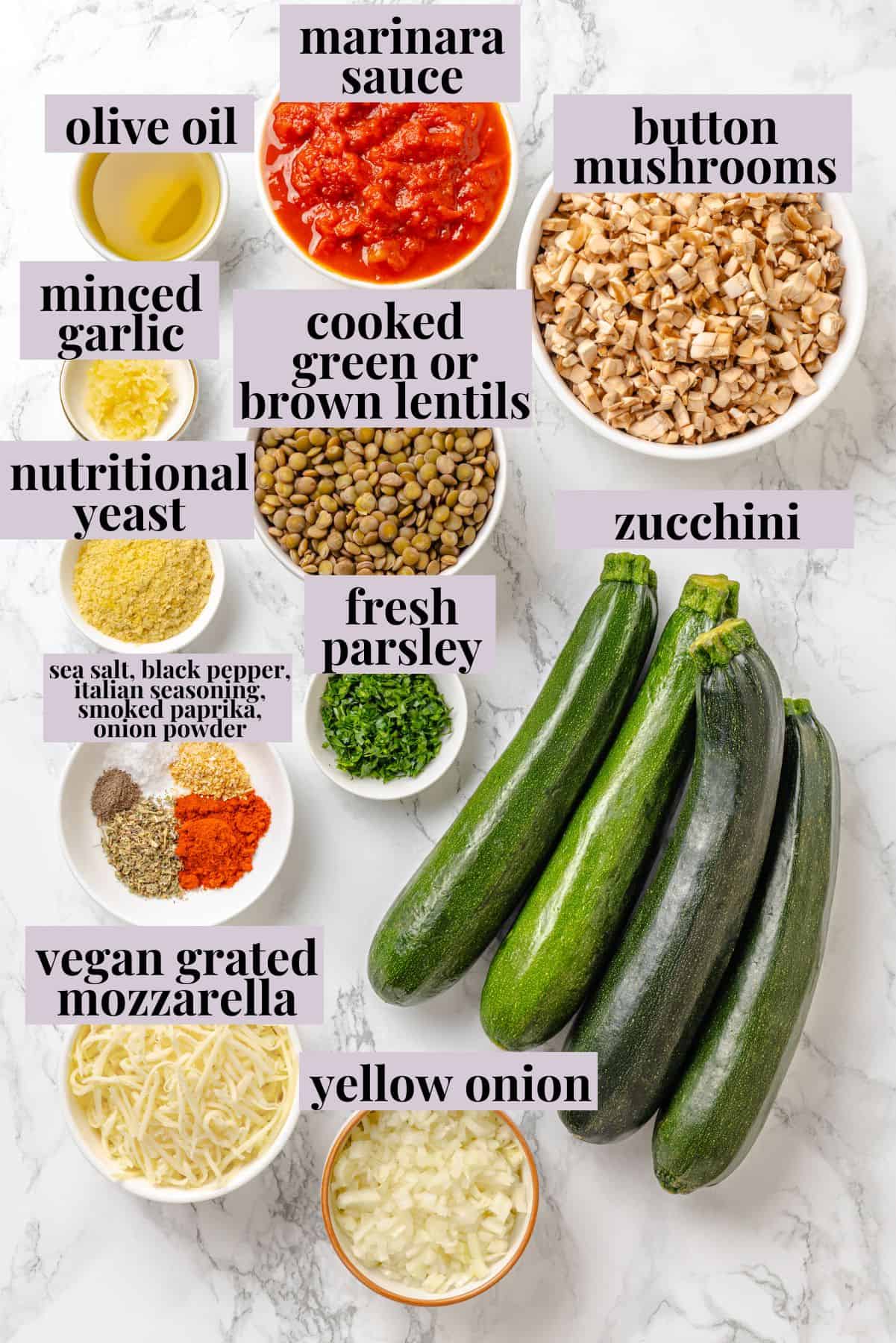 These stuffed zucchini boats are loaded with rich marinara sauce, melty vegan mozzarella, and protein-packed lentils. The perfect summer side. Labeled ingredients for stuffed zucchini boats recipe.