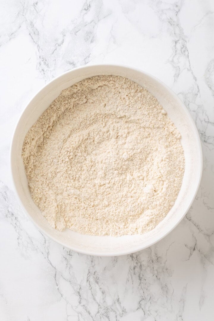 A bowl full of the dry ingredients for cobbler topping.