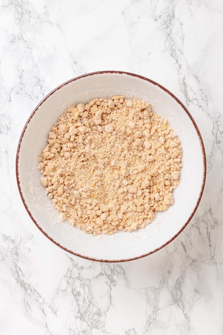 Vegan popcorn chicken features tender soy curls in a crunchy KFC-style breading served with a maple Dijon sauce. It beats takeout any day! Adding a little vegan buttermilk to KFC-style coating for vegan popcorn chicken.