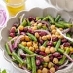 A serving bowl loaded with the best three bean salad.