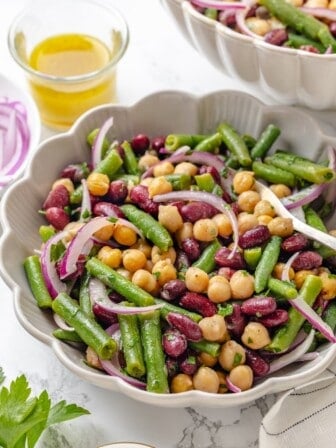 A serving bowl loaded with the best three bean salad.