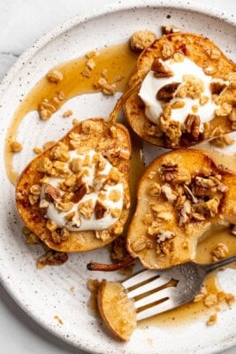 Cinnamon baked pears topped with coconut cream and granola.