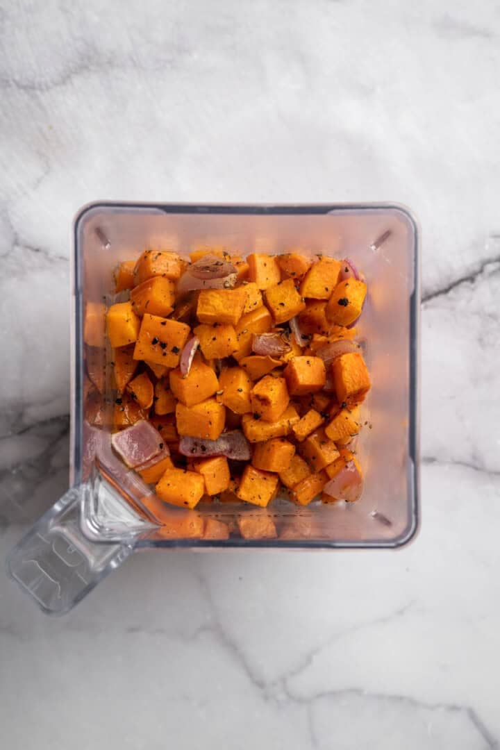 Roasted sweet potatoes, red onion, and garlic in a blender.