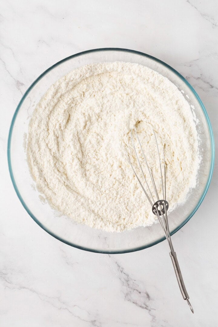 Perfectly soft and chewy, these homemade vegan flour tortillas puff up beautifully in the pan and are ideal for your next burrito. Mixing together the dry ingredients to make flour tortillas.