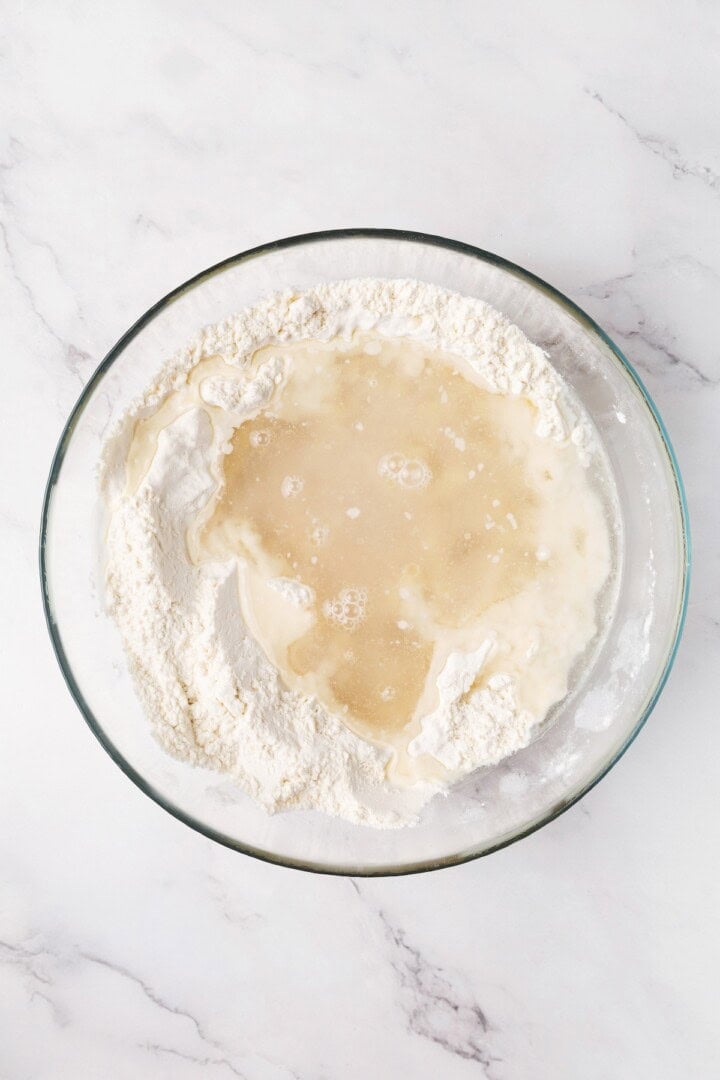 Perfectly soft and chewy, these homemade vegan flour tortillas puff up beautifully in the pan and are ideal for your next burrito. Adding warm water and oil to the dry ingredients for flour tortillas.