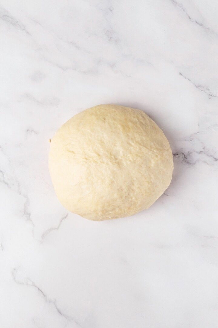 Perfectly soft and chewy, these homemade vegan flour tortillas puff up beautifully in the pan and are ideal for your next burrito. Flour tortilla dough kneaded into an elastic ball.