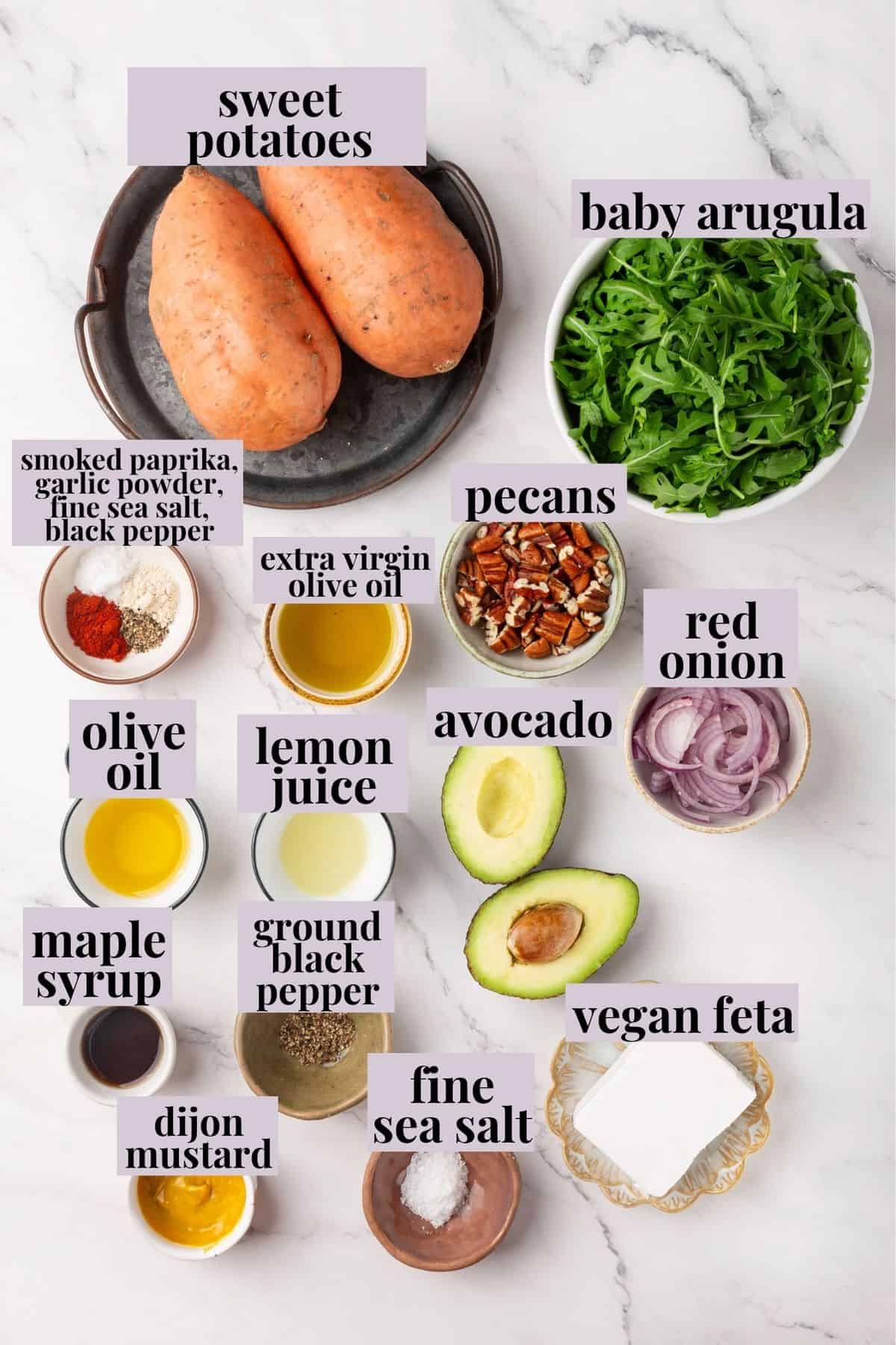 This sweet 'n savoury sweet potato salad is full of warm, tender sweet potatoes, crisp, peppery arugula, toasted pecans, and tangy vegan feta. Labeled ingredients for sweet potato arugula salad.