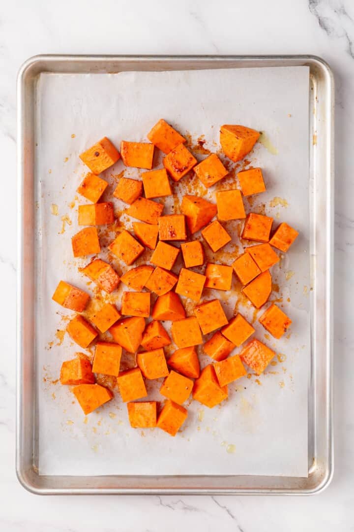 This sweet 'n savoury sweet potato salad is full of warm, tender sweet potatoes, crisp, peppery arugula, toasted pecans, and tangy vegan feta. Seasoning cubed sweet potato with smoked paprika, garlic powder, salt, and pepper.