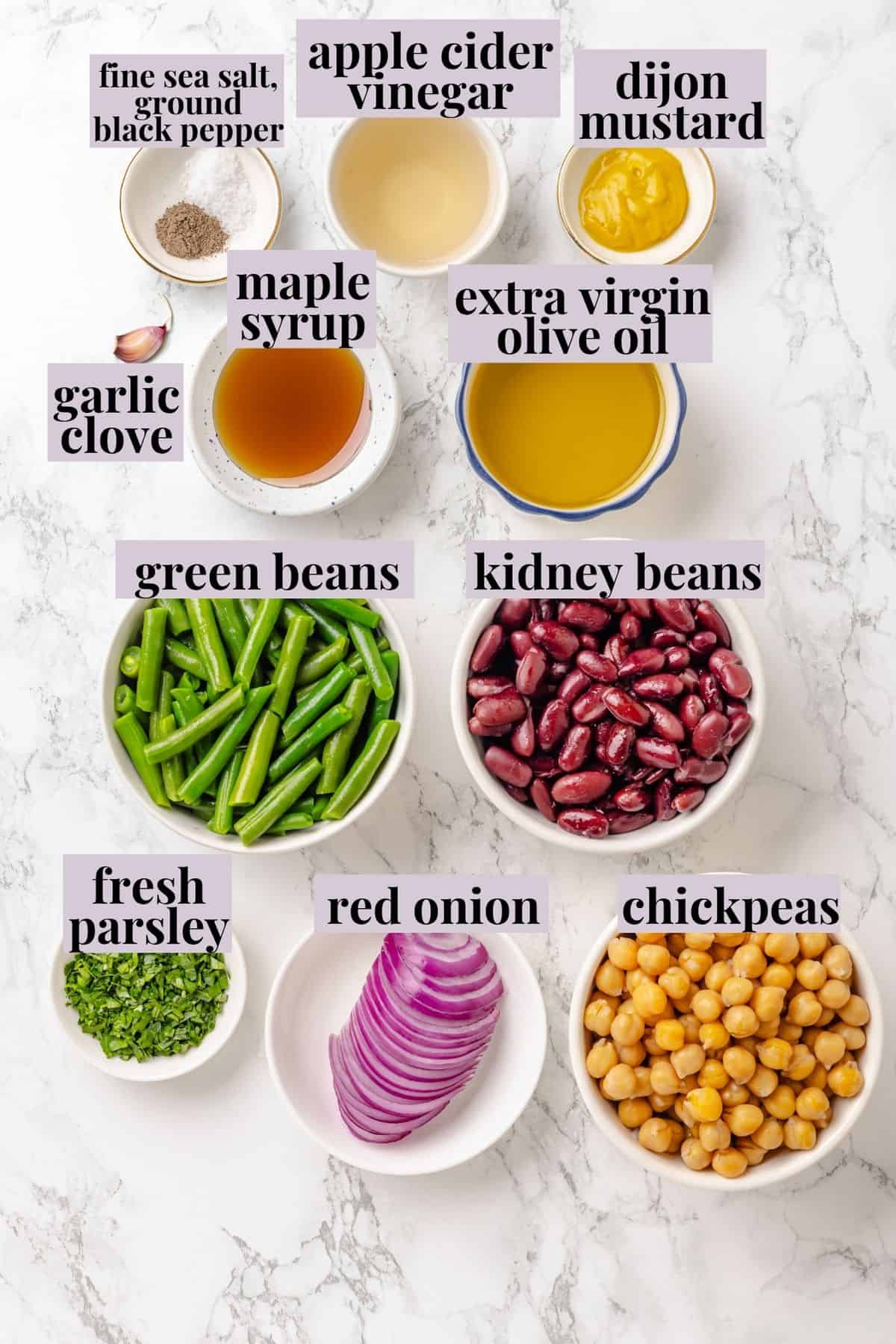 Three bean salad is made with creamy kidney beans, chickpeas, and crisp green beans marinated in a perfectly balanced maple-Dijon dressing. Labeled ingredients for three beans salad recipe.