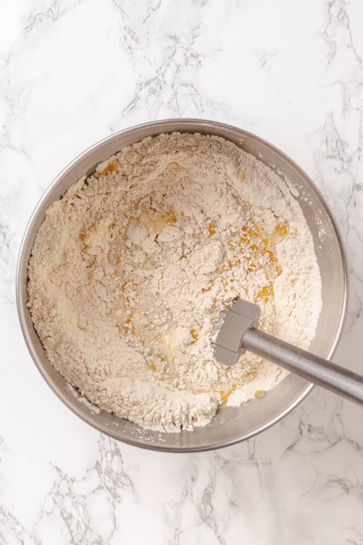 Fabulously fluffy, filled with soft, cinnamony apples, and topped with cream cheese frosting, you need these apple cinnamon rolls now. Mixing soy milk, vegan butter, and cooled tangzhong into a mixture of flour, brown sugar, yeast, salt, and cinnamon.