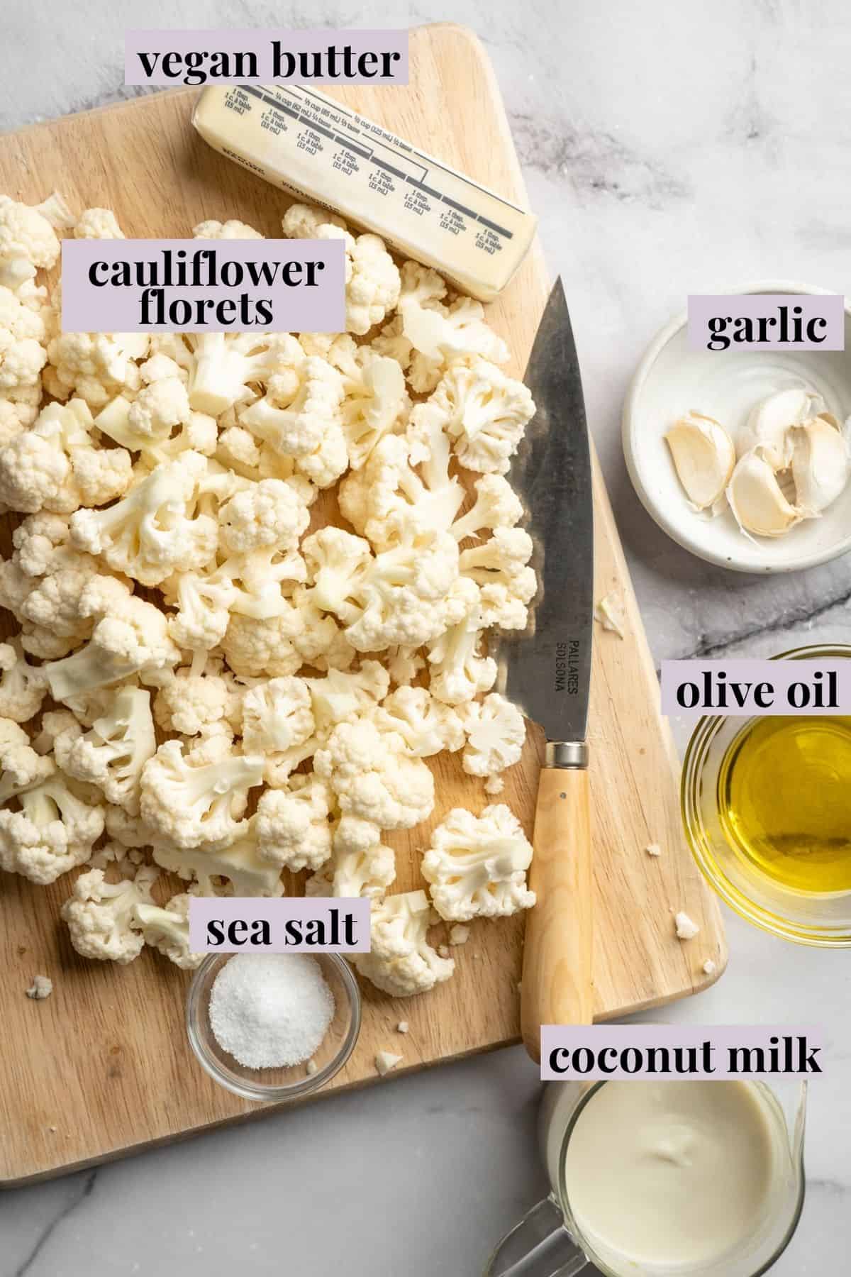This cauliflower mash is made with roasted cauliflower and garlic for the ultimate sauvoury flavour, and coconut milk for a silky finish. Labeled ingredients for vegan mashed cauliflower.