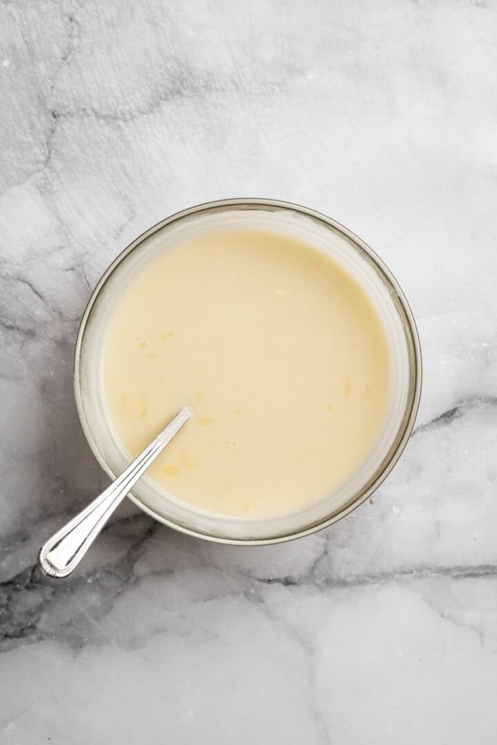 This cauliflower mash is made with roasted cauliflower and garlic for the ultimate sauvoury flavour, and coconut milk for a silky finish. Vegan butter and coconut milk melted together in a bowl.