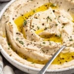 A bowl of vegan mashed cauliflower topped with olive oil.